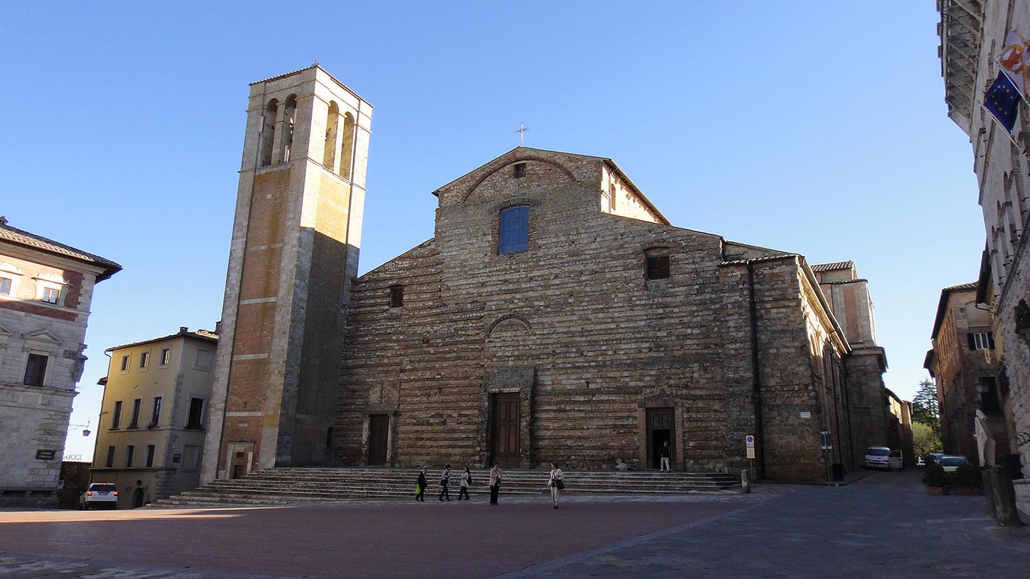 Which churches should be visited in Montepulciano?